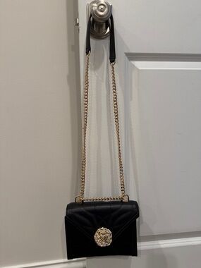 Michael Kors Black Quilted Crossbody with Gold Chain and Floral Medallion